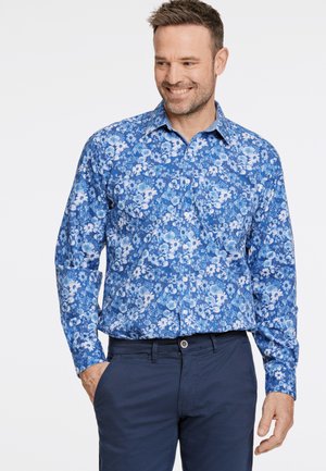 Camicia a bottoni floreale blu con una varietà di tonalità di blu, caratterizzata da un colletto alla francese, maniche lunghe e un design slim fit.