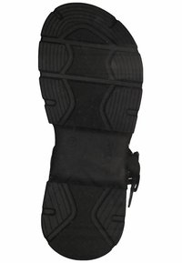 Suela de zapato de goma negra con patrones de relieve texturizados, bordes redondeados y un área de marca con el logo "s.Oliver" grabado.