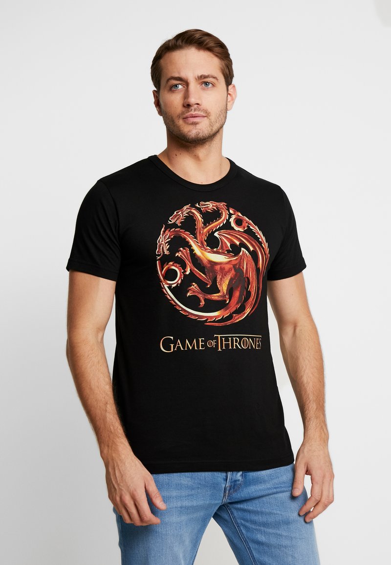 Schwarzes Baumwoll-T-Shirt mit einem farbenfrohen Drachenmotiv und dem Text "Game of Thrones", rundem Halsausschnitt und kurzen Ärmeln.