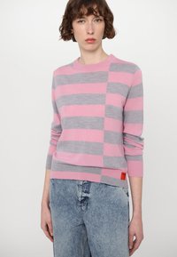 Pullover sweater with pink and gray horizontal stripes, crew neck, and long sleeves. Features a small red label at the hem.