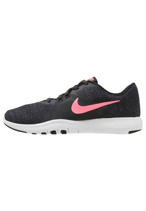 Chaussure de running Nike Flex noire et rose avec empeigne en mesh, semelle blanche et swoosh rose sur le côté.