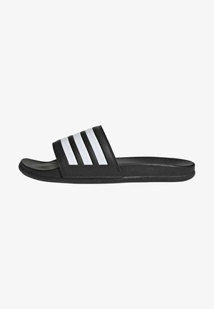 Black slide sandal with three white stripes on the strap, made of synthetic material, featuring a textured footbed and flat sole.