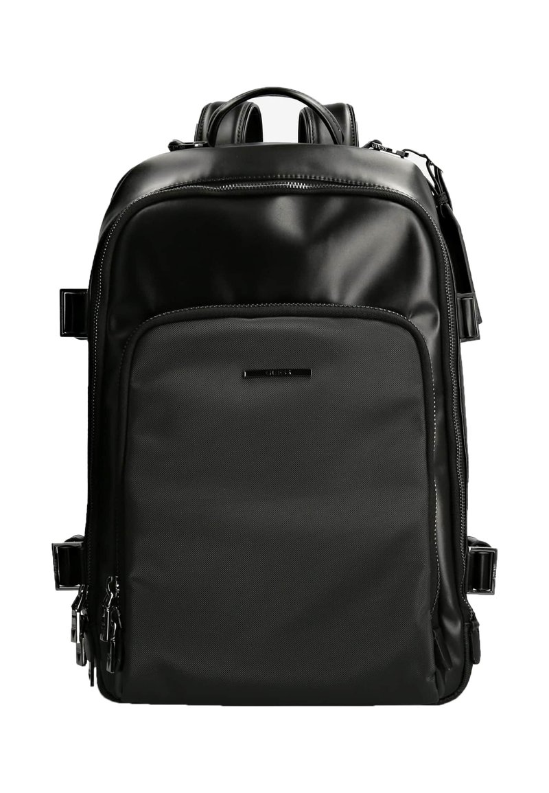 Svart ryggsäck gjord av ett slätt, hållbart material. Har ett stort huvudfack, framficka och flera dragkedjor. Minimalistisk design.