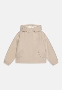 Beige jakke med hette, med glidelås foran, to skrå lommer og elastiske mansjetter. Glatt ytre, enkel design og subtil merkevare.