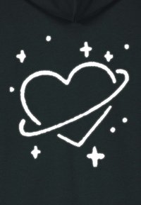 Black fabric featuring a white graphic of a heart encircled by a ring, adorned with stars and dots, creating a celestial theme.