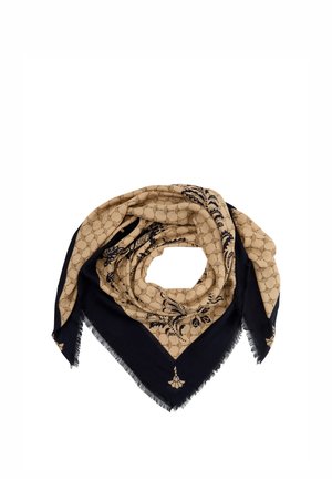 Beige en zwart vierkant sjaal met franjes aan de randen, met een geometrisch en bloemrijk patroon, opgevouwen in een cirkelvorm op een witte achtergrond.