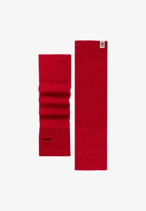 Red knitted arm warmers with ribbed texture; one has a thumb hole. Each piece is rectangular, featuring a small brand label.