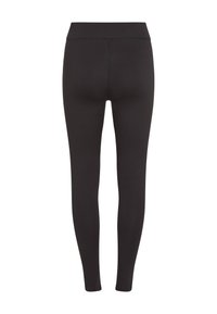 Black leggings made of stretchy fabric, featuring a high waistband and fitted design with smooth, seamless construction.