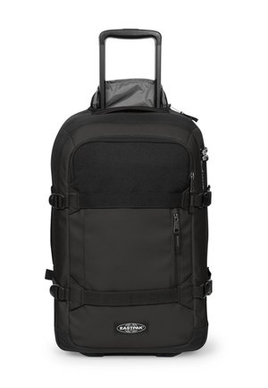 Black Eastpak rolling suitcase with retractable handle, front zip pocket, compression straps, and Eastpak logo at the bottom center.