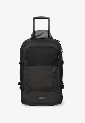 Maleta negra Eastpak con ruedas, asa retráctil, bolsillo frontal con cremallera, tirantes de compresión y logo de Eastpak en el centro inferior.