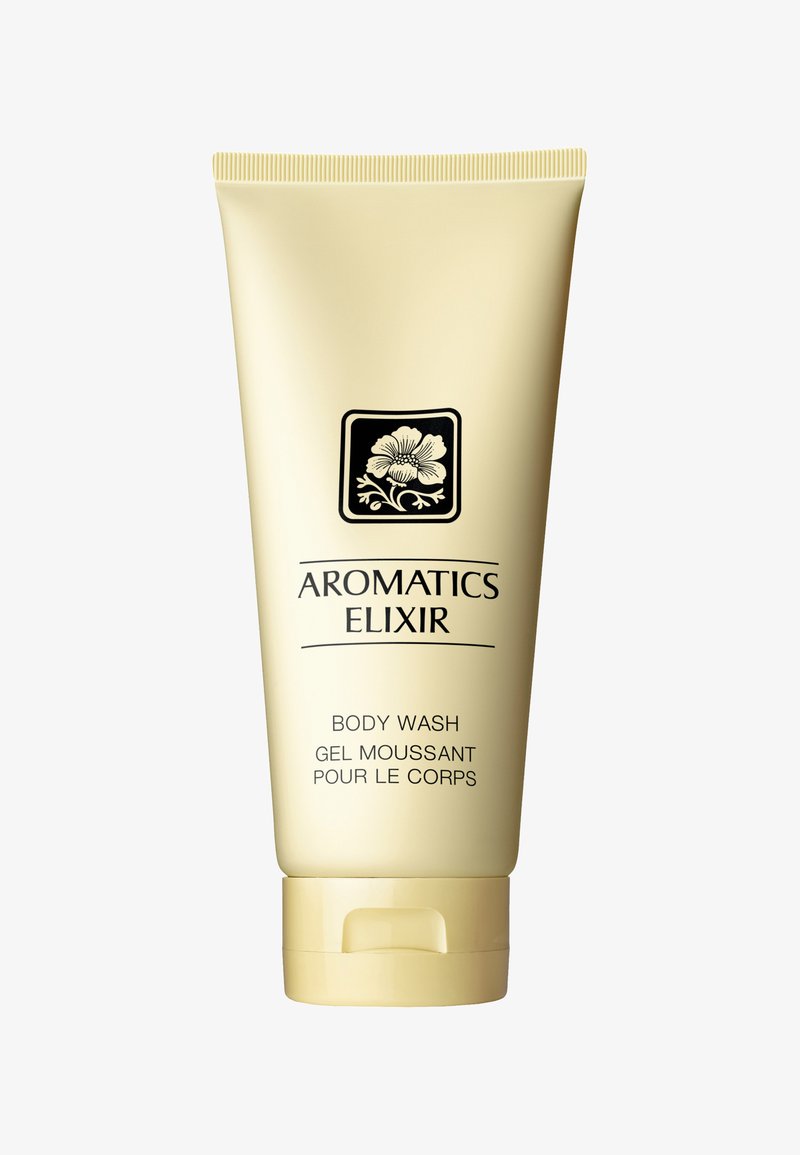 Helles gelbes Rohr mit Körperwäsche, schwarz floralem Design und Text. Schraubverschluss, glatte Textur, beschriftet mit "Aromatics Elixir Body Wash."