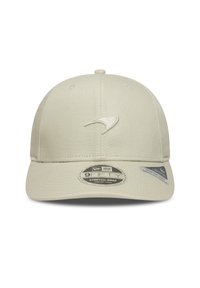 Beige baseball cap with a curved brim, embroidered logo on the front, and a stretch-snap closure. Material is smooth fabric.