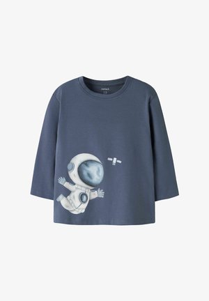 Children's long-sleeve blue shirt with a graphic of a floating astronaut and a satellite on the front.