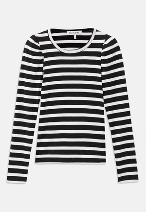 Long-sleeve, ribbed top with black and white horizontal stripes. Features a round neckline and contrasting trim. Soft fabric texture.