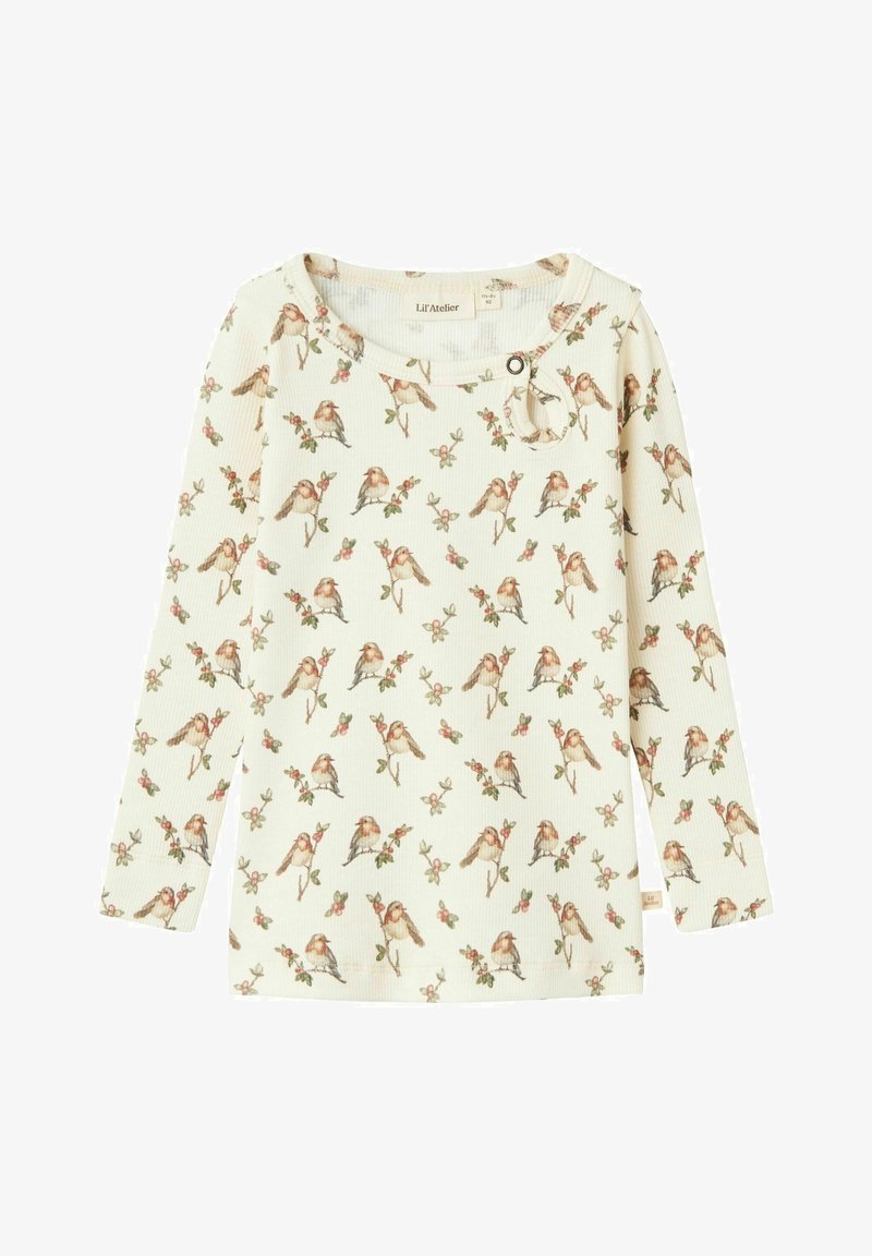 T-shirt en coton à manches longues couleur crème avec une texture côtelée, présentant un imprimé d'oiseaux et de fleurs, un col rond et un bouton décoratif.
