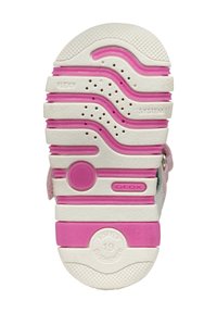 Suola di calzature con un design ondulato, prevalentemente bianca con accenti rosa. La superficie include fori di ventilazione e una sezione imbottita.