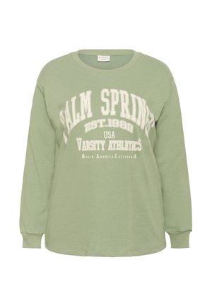 Sweatshirt vert clair à manches longues avec un texte blanc "Palm Springs EST. 1982 USA Varsity Athletics North America California" sur le devant.