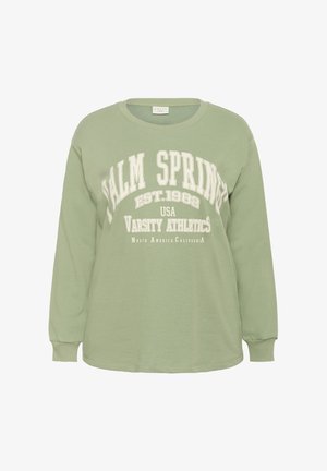 Hele rohelise pika varrukaga sviiter valge tekstiga "Palm Springs EST. 1982 USA Varsity Athletics North America California" ees.