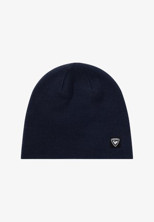 Beanie lavorato a maglia di un blu navy scuro con una piccola toppa con logo Rossignol in bianco e nero sul lato in basso a destra.