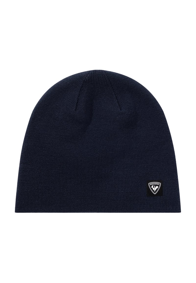 Beanie lavorato a maglia di un blu navy scuro con una piccola toppa con logo Rossignol in bianco e nero sul lato in basso a destra.