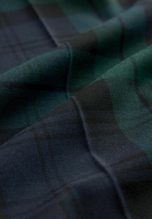 Woven fabric featuring a dark plaid pattern with shades of green and black. Soft texture with smooth folds and a dense weave.