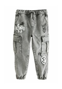 Gray cargo pants feature an elastic waistband, side pockets, and decorative graphics, including a skull and graffiti-style text.
