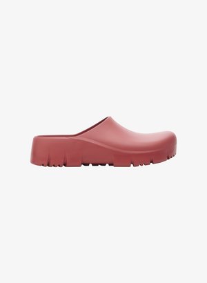 Red rubber clogs with a wide opening, smooth surface, thick sole, and textured bottom for traction. Simple, rounded design without embellishments.