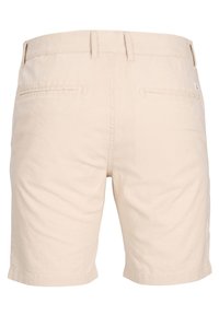 Béžové bavlněné kraťasy s hladkou texturou, které mají dvě zadní kapsy a rovný střih. Pas má poutka na pásek.