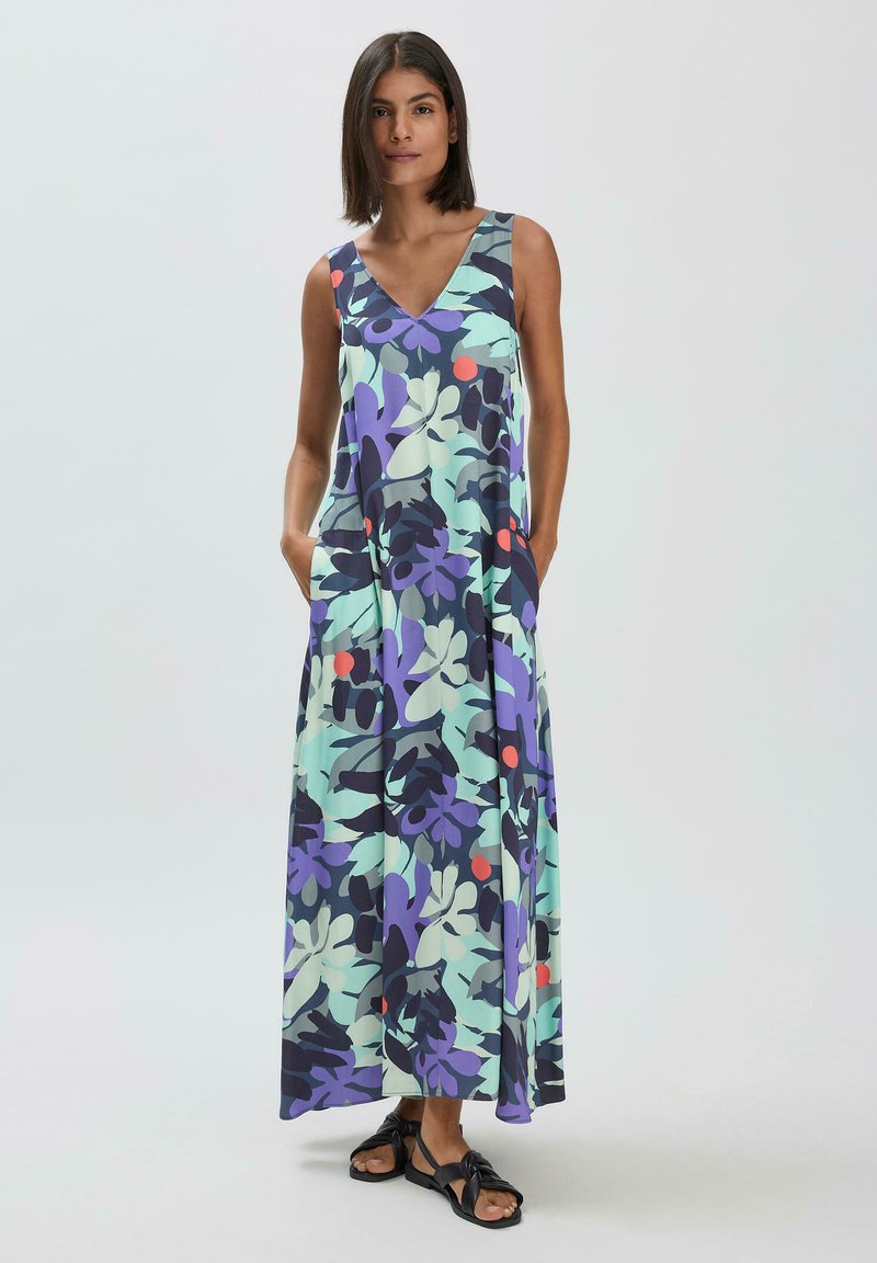 Maxikleid aus leichtem Stoff, mit V-Ausschnitt, lebhaftem Blumenmuster in Lila, Grün und Rot, ausgestattet mit Taschen für zusätzliche Funktionalität.