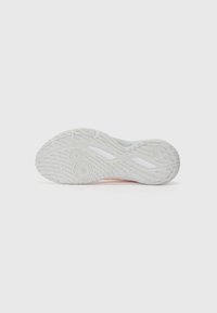 White athletic shoe sole with textured pattern, featuring a pink accent and circular traction elements for grip and stability.
