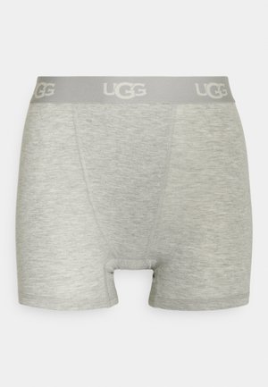 Boxer en gris fabriqué en tissu doux et chiné. Doté d'une taille élastique avec le logo UGG. Coupe courte avec une ouverture à l'avant.