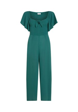 Σαλοπέτα σε τιρκουάζ με τετράγωνο ντεκολτέ, σμιλευμένο μπούστο, κοντά μανίκια με βολάν και παντελόνι με φαρδιά μπατζάκια. Λείο ύφασμα με ομοιόμορφη υφή.