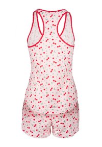 Krátká pyžamová sada obsahující bezrukávový top s potiskem třešní, lemovaný červenou barvou, doplněný o odpovídající šortky. Vyrobeno z měkké tkaniny.