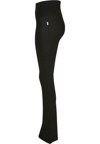 Leggings noirs avec une taille haute, fabriqués en tissu lisse. Conception ajustée avec un ourlet évasé en bas, adaptés à diverses activités.