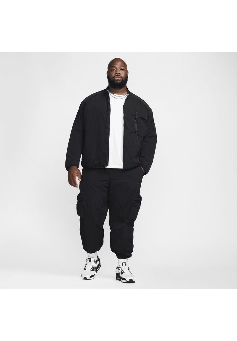 Nike Sportswear Lichte jas zwart Nike Sportswear Lichte jas zwart