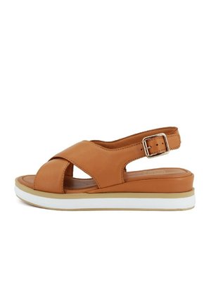 Sandali in pelle tan con punta aperta, design a strappo incrociato, fibbia per caviglia regolabile e suola intermedia bianca. Suola piatta e confortevole.