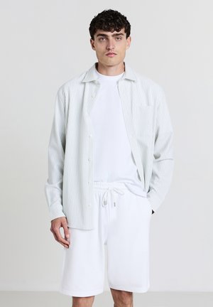 GINNICO - Pantalon de survêtement - bianco ottico