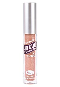 Sprankelende vloeibare oogschaduw in een doorzichtig buisje, met een metalen zilveren dop. Het product heeft een glinsterende roségoud tint met een gladde afwerking.