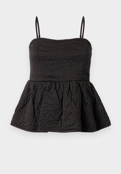Black peplum top with adjustable spaghetti straps, textured fabric featuring swirled design, and gathered lower hem for volume.