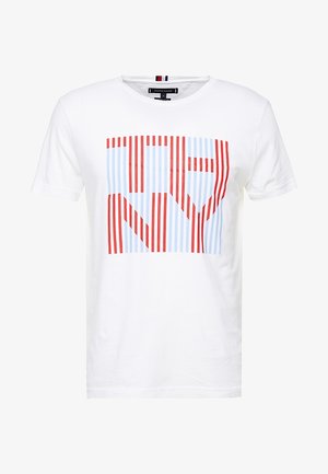 White short-sleeve T-shirt with a square graphic of vertical red and light blue stripes forming the letters "NY".