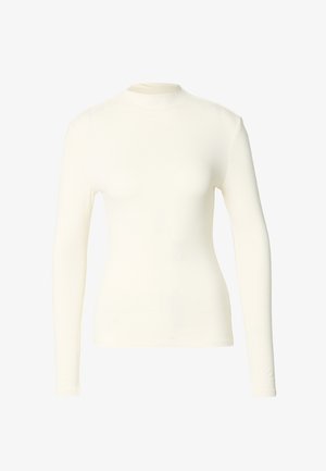 Långärmad topp i mjukt krämfärgat tyg med hög krage och figurnära passform. Slät yta, minimal detaljering och inga synliga stängningar.