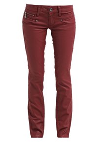 Röda slim-fit jeans i mjukt tyg, med framfickor, dekorativa dragkedjor och enstaka knäppning.