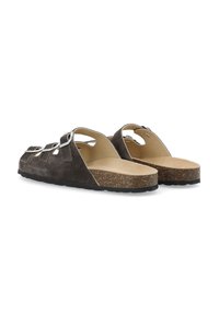 Sandali in suede marrone con soletta in sughero, apertura sul retro e numerosi ritagli decorativi. Presentano una suola testurizzata per una buona presa.