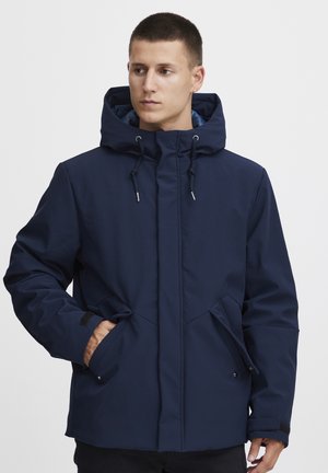 Navy insulated jacket with a hood, featuring adjustable drawstrings, side pockets, and a smooth texture. Front closure with integrated design details.