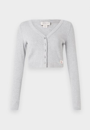 Gray cropped cardigan made of soft fabric, featuring a V-neck, long sleeves, six button closure, and a small logo tag on the front.