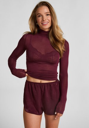 Burgundy long-sleeve top with a mesh fabric and fitted silhouette, paired with matching loose-fit shorts featuring an elastic waistband.