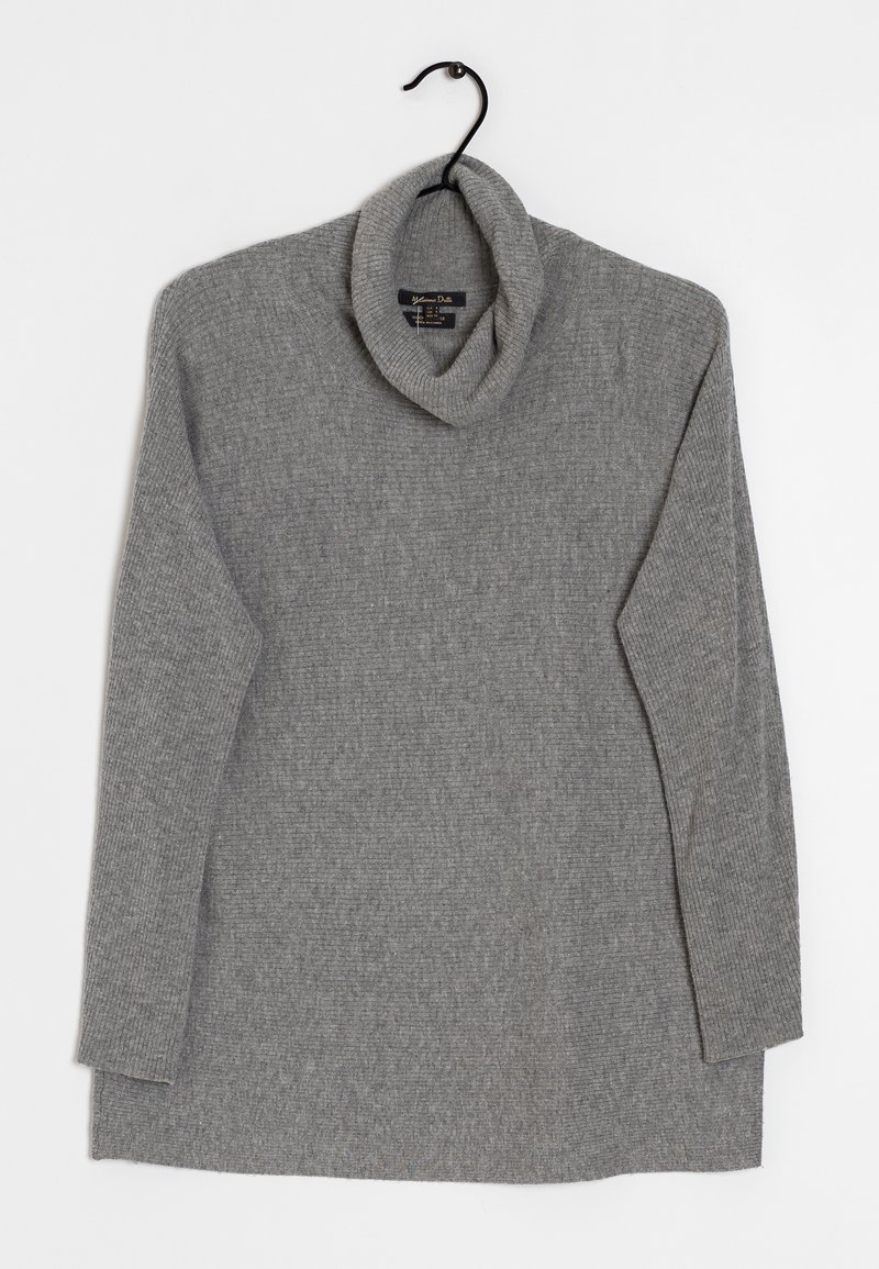 Gray knitted turtleneck sweater with ribbed texture, long sleeves, and a slightly loose fit. Hangs on a black hook against a light background.