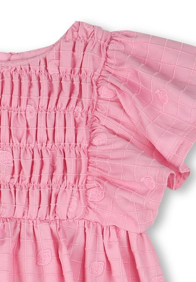 Light pink dress featuring a smocked bodice, ruffled sleeves, and a textured, patterned fabric with subtle floral accents.