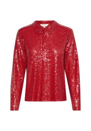 Blouse rouge à manches longues en tissu paillettes. Dotée d'un col classique et d'une coupe ample, avec des détails brillants sur toute la surface.