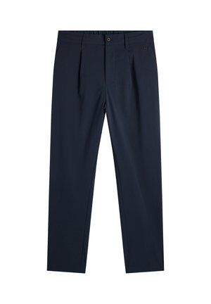 Granatowe, dopasowane spodnie z plisami, szlufkami, zapięciem na guziki z przodu oraz małym metalowym logo na prawym kieszeni.
